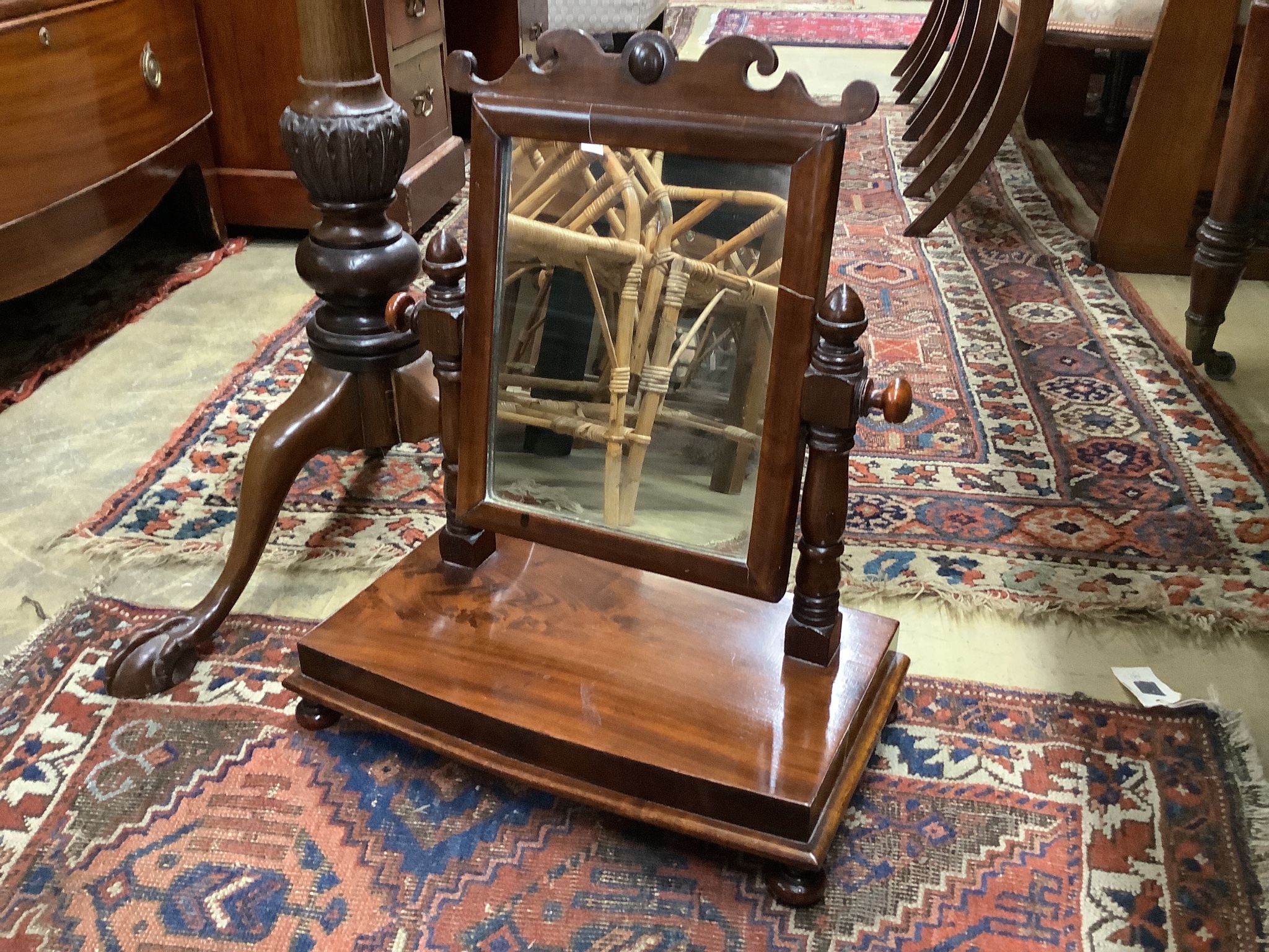 A Chippendale revival mahogany tripod torchere, height 113cm together with a Victorian mahogany toilet mirror